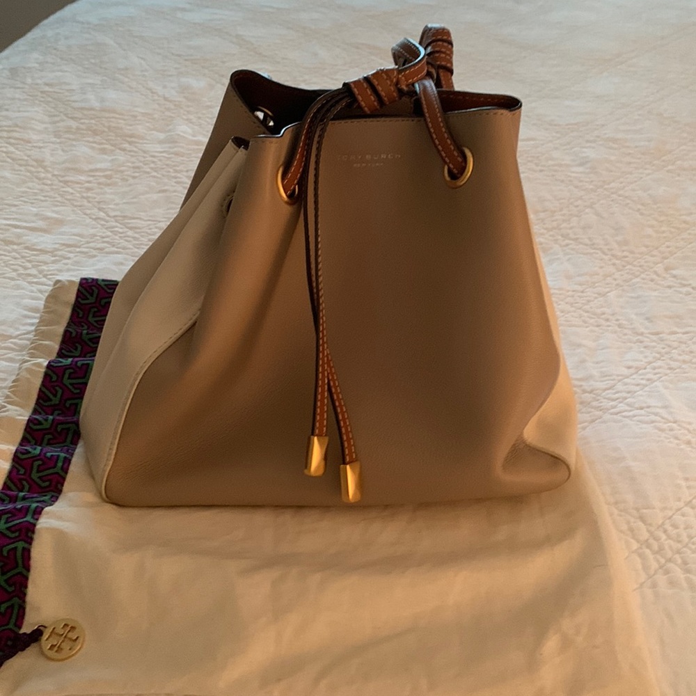 Tory Burch leather handbag. 10 1/2” by 9”  12” strap